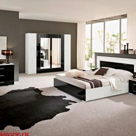 Спальня в черно белой гамме, прямые лаконичные формы, высокий глянец